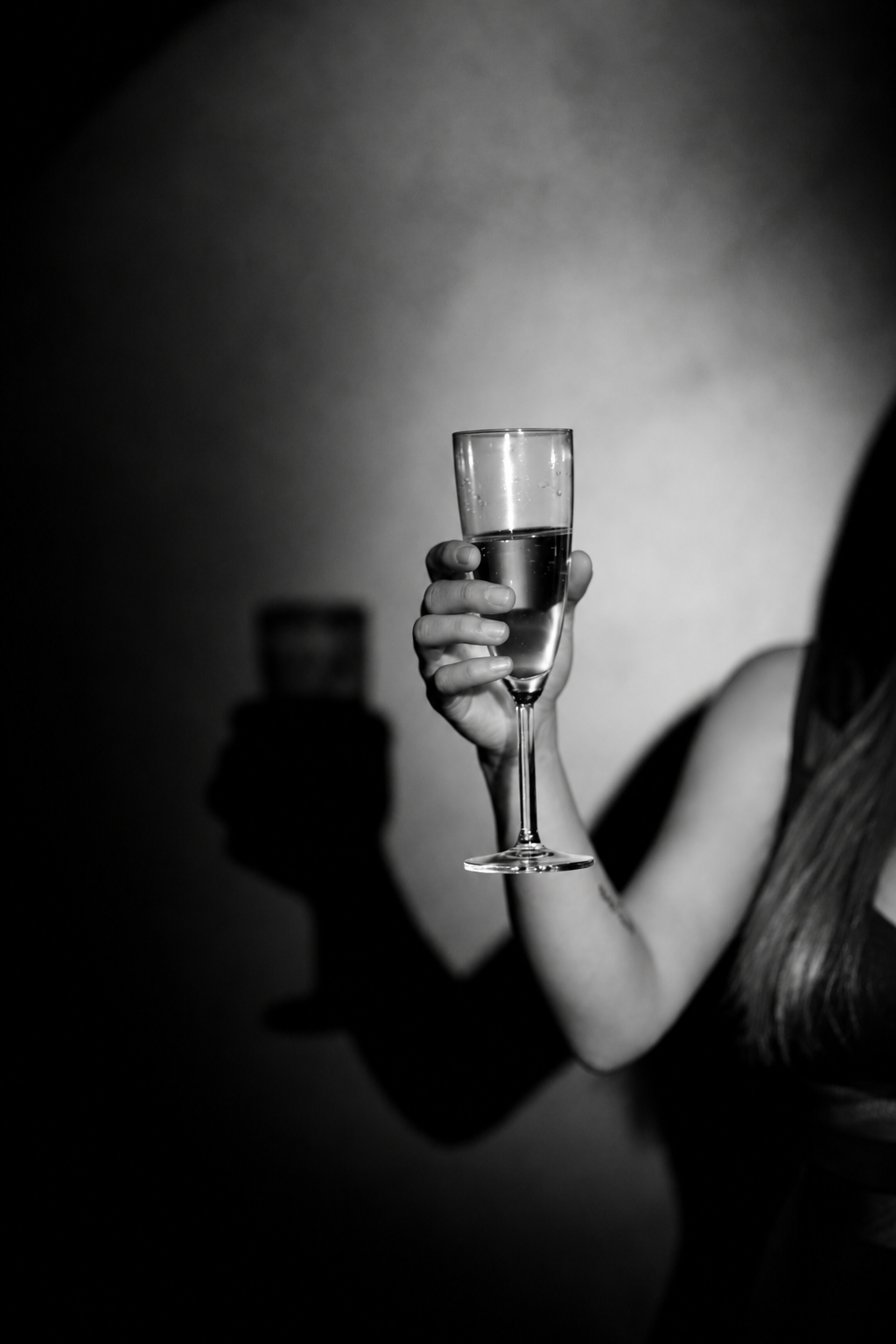 woman holding champagne glass